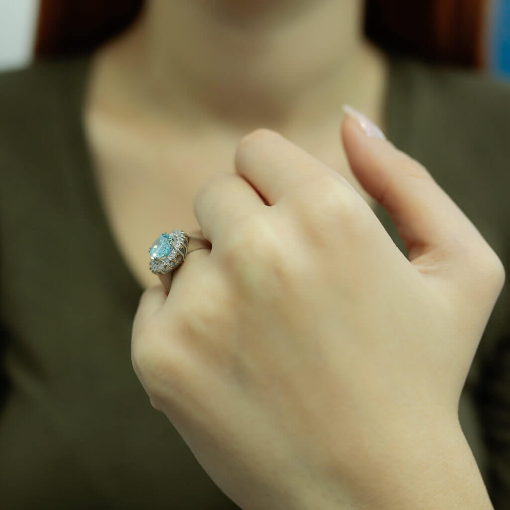 Oval Blue Topaz Entourage Ring with Diamonds
