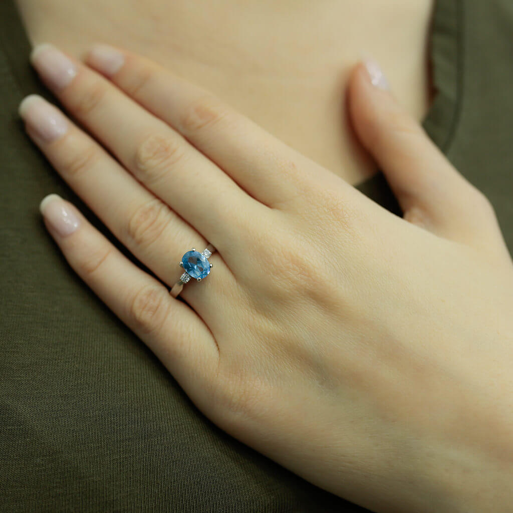Oval Blue Topaz Ring with Diamonds