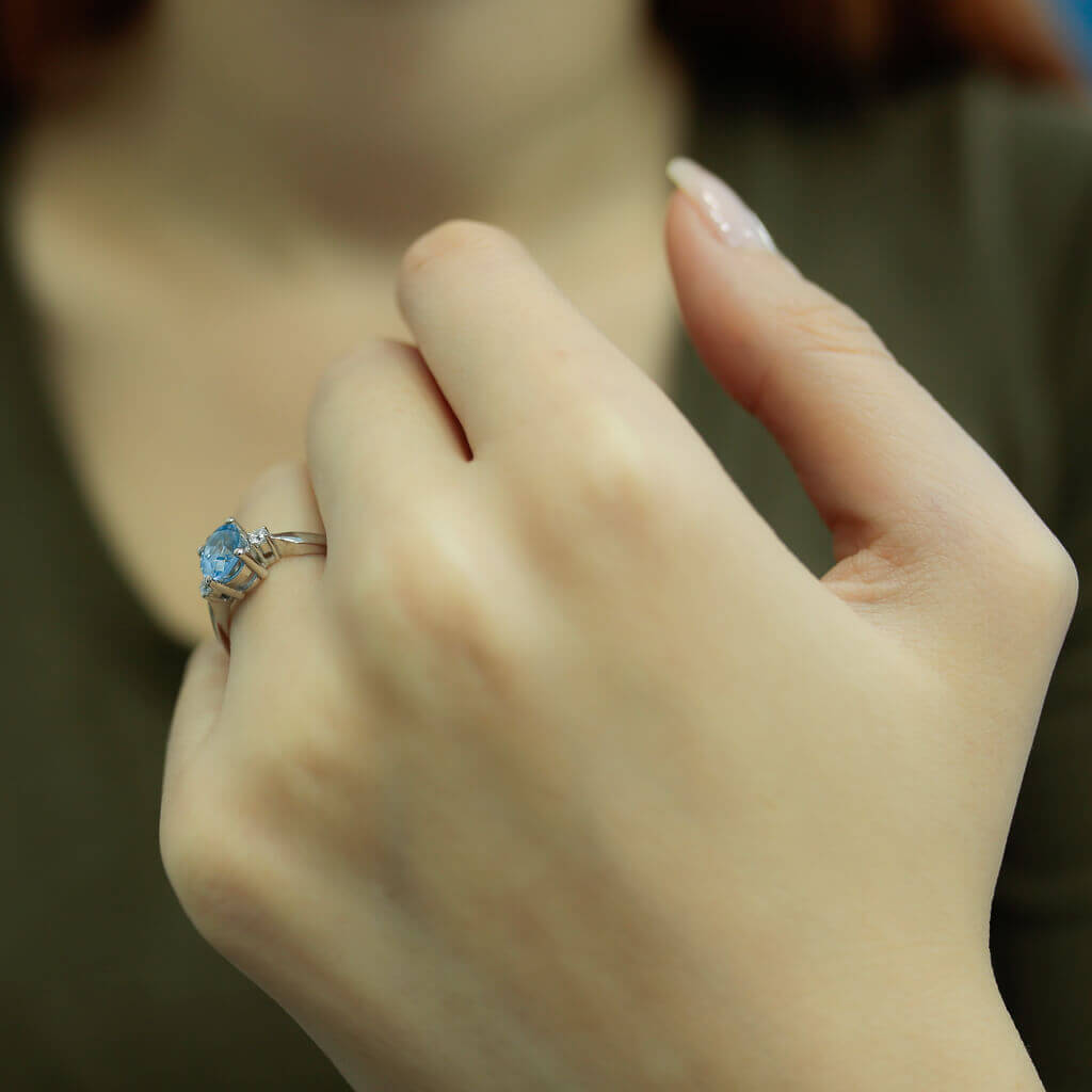 Oval Blue Topaz Ring with Diamonds